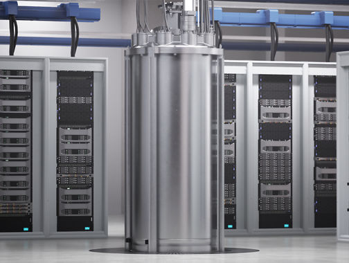 Cryogenic quantum computing hardware in a data center, surrounded by server racks and cabling infrastructure.